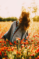 Sticker - Happy beautiful woman relaxing in poppy flower field.