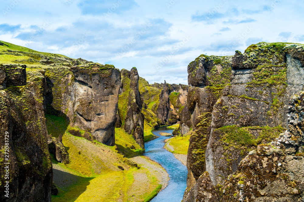 Iceland canyon fjaðrárgljúfur with river flowing through it - obrazy, fototapety, plakaty 