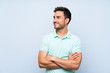 © luismolinero - Handsome young man over isolated background happy and smiling