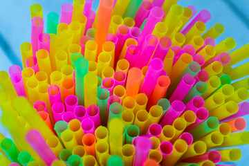 Colorful plastic straws drinking background