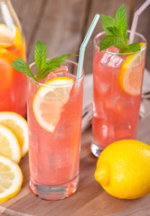 Glasses of Raspberry Lemonade With Lemon Slices