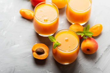 Fresh apricot juice on the marble table