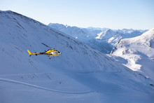 Helicopter Flying Above Scenery With Majestic Mountains