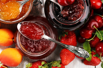 Wall Mural - assortment of jams, seasonal berries, apricot, mint and fruits. marmalade or confiture