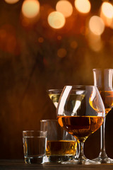 Strong Spirits Set. Hard alcoholic drinks in glasses in assortment: vodka, cognac, tequila, brandy and whiskey, grappa, liqueur, vermouth, tincture, rum. 