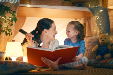 Wall Mural - mother and daughter playing in tent