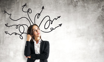 Wall Mural - Portrait of attractive businesswoman with arrows