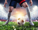 Fototapeta Sport - Soccer player ready to kick the soccerball at the stadium during the match.