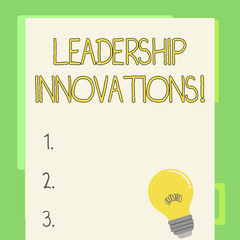 Fototapete - Handwriting text writing Leadership Innovations. Conceptual photo Style to impact employees to produce creative ideas Incandescent Light Bulb with Filament Inside Resting on Blank Color Paper
