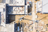 Fototapeta Miasto - construction of new public building. aerial top view of city construction site.