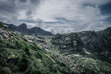 Wall Mural - view of a mountain valley on a cloudy day