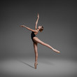 © Yevgeniy - Beautiful flexible ballerina dancing in studio