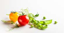 Fresh Green  Peas Pods With Sprouts And Cherry Tomatoes