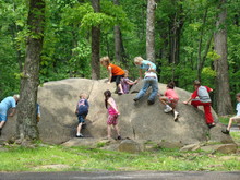 Kids Playing On Big Rock