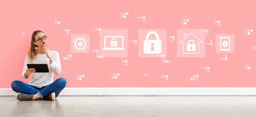 Wall Mural - Cyber security with young woman holding a tablet computer