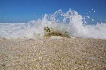 Ocean wave crashing against the rocks