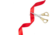 Grand Opening. Top View Of Gold Scissors Cutting Red Ribbon On Wite Background.