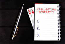 Conceptual Hand Writing Showing Intellectual Property. Concept Meaning Protect From Unauthorized Use Patented Work Or Idea Writing Equipments Placed Next To A Gadget Vintage Lantern