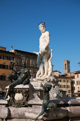 Wall Mural - Florence, Italy - April 15, 2019: View of The Fountain of Neptune in Piazza della Signoria