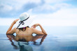 © Peera - Asian woman relax in pool on beach