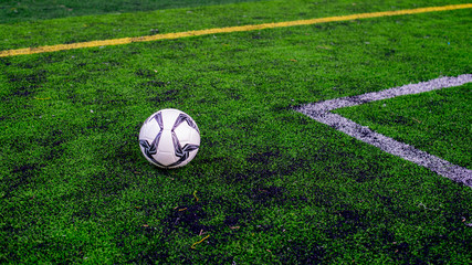 soccer ball on green field, football on green field