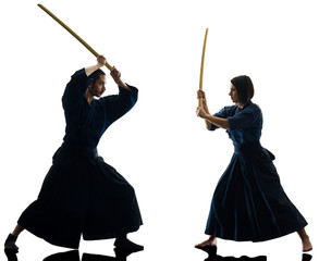 caucasian man and woman practicing laido Katori Shinto ryu isolated shadow silhouette on white background