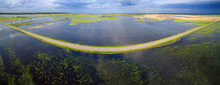 Road Through Flooded Fields. Panorama.