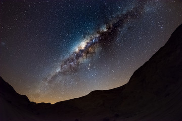 Wall Mural - starry sky and milky way arch, with details of its colorful core, outstandingly bright, captured fro