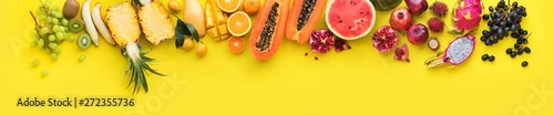 Fotografía Rainbow of different exotic tropical fruits line yellow