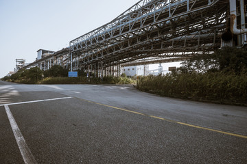 Wall Mural - Asphalt concrete flooring and factory buildings