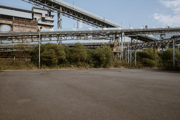 Wall Mural - Asphalt concrete flooring and factory buildings