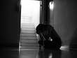 © thebigland45 - Silhouette of girl sitting alone in the dark, Domestic violence, family problems, Stress, violence, The concept of depression and suicide