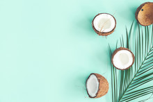 Summer Composition. Coconut, Palm Leaf On Mint Background. Summer Concept. Flat Lay, Top View, Copy Space