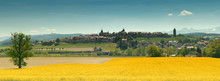 Panorama View Of The Village Of Romont In Switzerland With The Alps In The Background