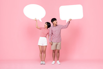 Lovely young Asian couple with speech bubbles