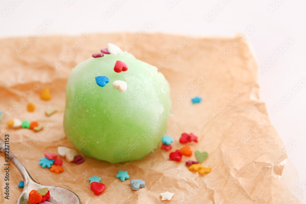 Ball of tasty shaved ice on parchment