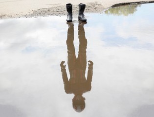 About water are worth moto shoes. In the reflection of the motorcyclist in gear