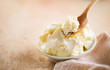 Mascarpone cream cheese closeup. Mascarpone soft milk cream in white bowl. Homemade ice cream, yoghurt