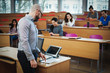 © Nejron Photo - Lecturer and multinational group of students in an auditorium