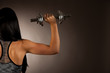 © Samo Trebizan - Active young woman wprkout with dumbbells in a fitness gym