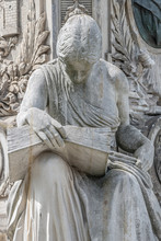 Ancient Fountain Statue Of Sensual Italian Renaissance Era Woman Reading A Big Book, Magdeburg, Germany