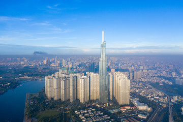 Wall Mural - Top View of Building in a City - Aerial view Skyscrapers flying by drone of Ho Chi Mi City with development buildings, transportation, energy power infrastructure. include Landmark 81 building 