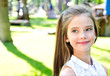 © svetamart - Portrait of adorable smiling little girl child schoolgirl teenager outdoors
