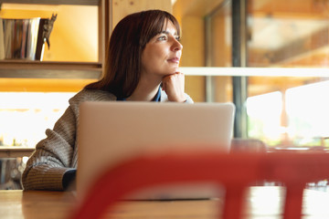 Poster - Woman working on a laptop