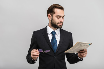 Handsome confident businessman wearing suit standing