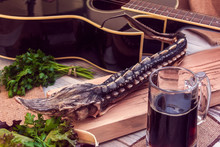 Dried Sturgeon With Dark Beer, Greens And Guitar