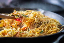 Process Of Cooking Of Sweet And Crunchy Stir Fry With Beansprouts And Noodles In The Wok, Macro Image