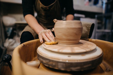 Potter Making Pots In Studio