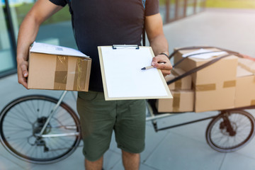 Canvas Print - Bicycle messenger making a delivery on a cargo bike