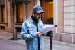 © Bonninstudio/Stocksy - Actor reading script waking on the street.